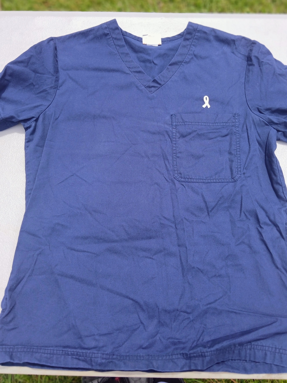 koi Women's Navy V-Neck Scrub Top with Chest Pocket and Ribbon Accent